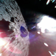 Image captured by Rover-1B on September 21 at around 13:07 JST. This color image was taken immediately after separation from the spacecraft. The surface of Ryugu is in the lower right. The coloured blur in the top left is due to the reflection of sunlight when the image was taken.